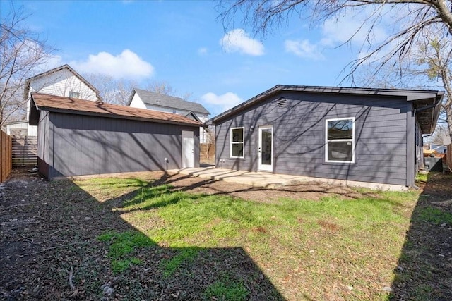 6811 Montana St, Austin, TX 78741 - rear view of property with a patio area and an outbuilding