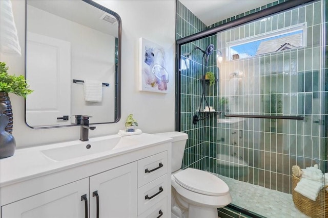 6811 Montana St, Austin, TX 78741 - full bath featuring toilet, a tile shower, and vanity