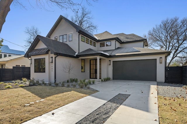 view of front of house featuring a garage and a front yard