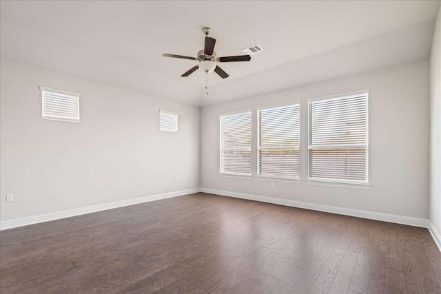 empty room featuring ceiling fan and dark hardwood / wood-style flooring