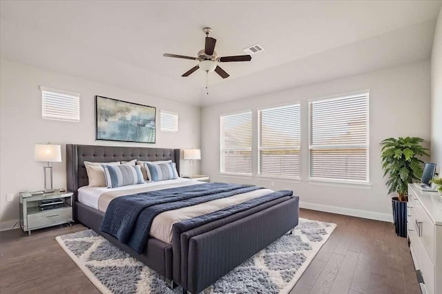 bedroom with ceiling fan and dark wood-type flooring