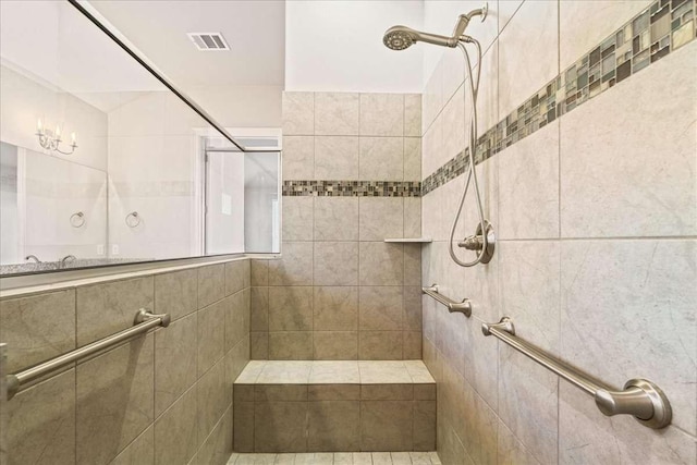 bathroom with a tile shower