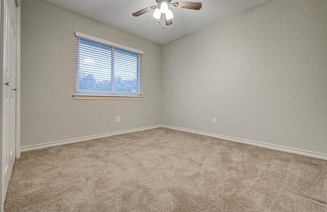 carpeted empty room with ceiling fan