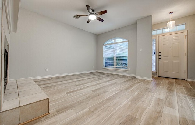 entrance foyer featuring ceiling fan and light hardwood / wood-style flooring