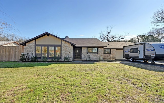 single story home with a front lawn