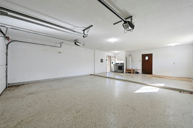 garage featuring water heater and a garage door opener