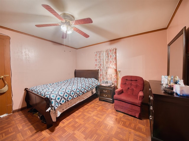 bedroom with parquet flooring, ceiling fan, and ornamental molding