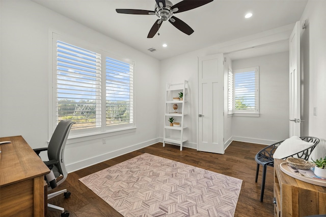 office area with ceiling fan, a wealth of natural light, and dark hardwood / wood-style floors