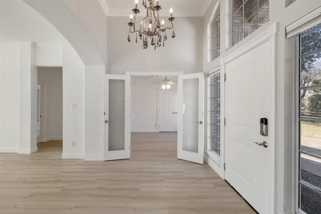 foyer with a chandelier and light hardwood / wood-style flooring