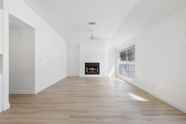 unfurnished living room with ceiling fan and light hardwood / wood-style flooring