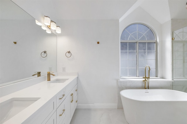 bathroom featuring a tub and vanity