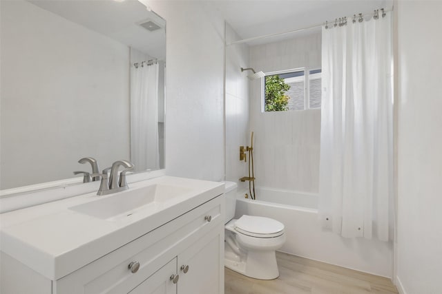 full bathroom with wood-type flooring, toilet, vanity, and shower / bath combination with curtain