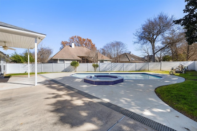 view of swimming pool with an in ground hot tub and a patio area