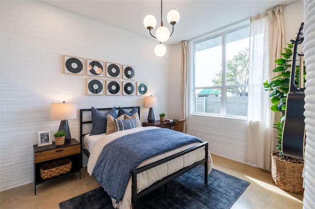 bedroom featuring a notable chandelier