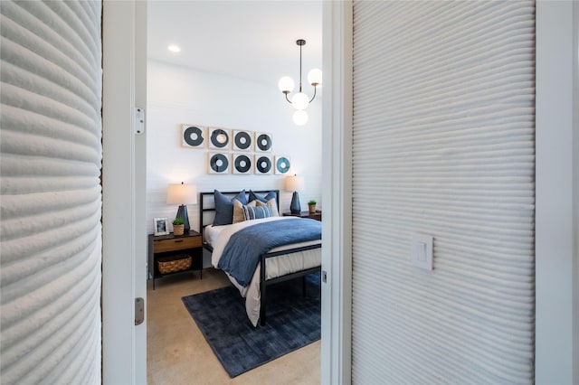 bedroom featuring a notable chandelier