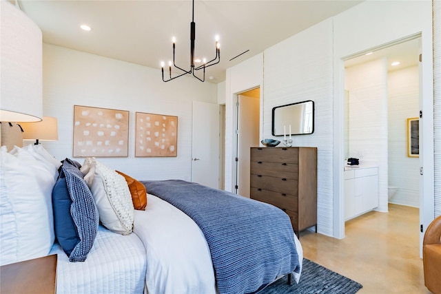 bedroom with ensuite bath and a chandelier