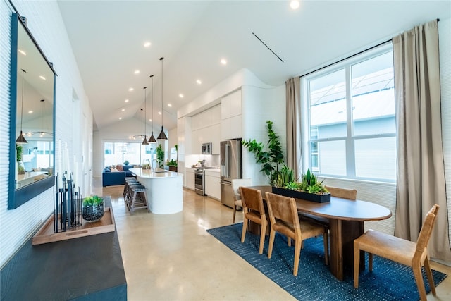 dining space with lofted ceiling