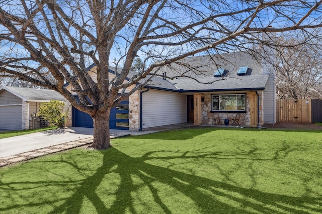 ranch-style home featuring a garage and a front yard