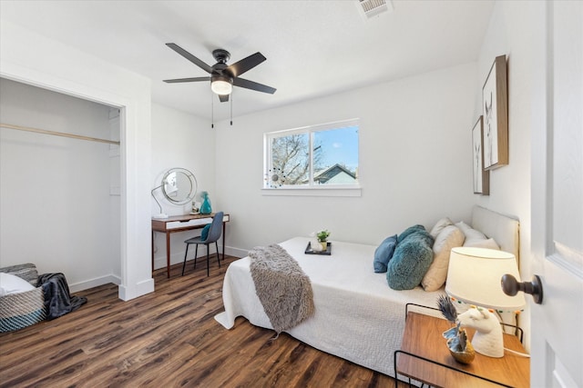 bedroom featuring a closet, ceiling fan, and dark hardwood / wood-style floors