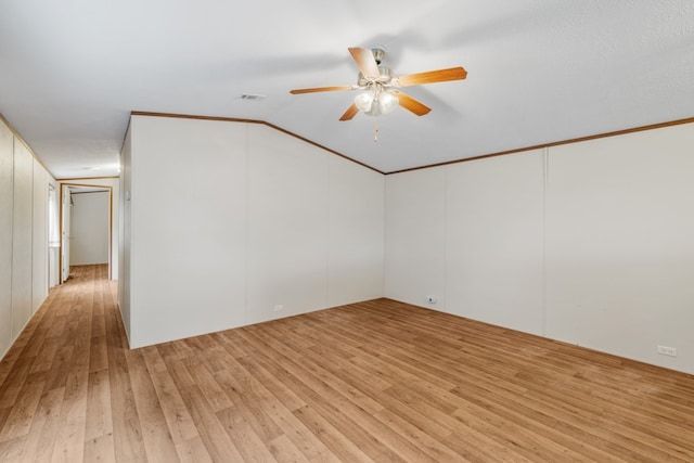 unfurnished room featuring light wood-type flooring, ceiling fan, crown molding, and lofted ceiling