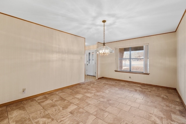 unfurnished dining area with ornamental molding and a chandelier