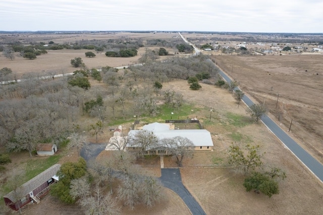 birds eye view of property featuring a rural view