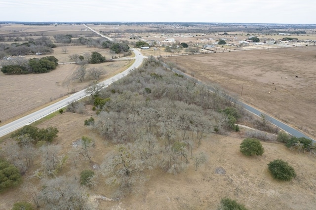 birds eye view of property with a rural view