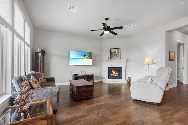 living room with ceiling fan and dark hardwood / wood-style floors