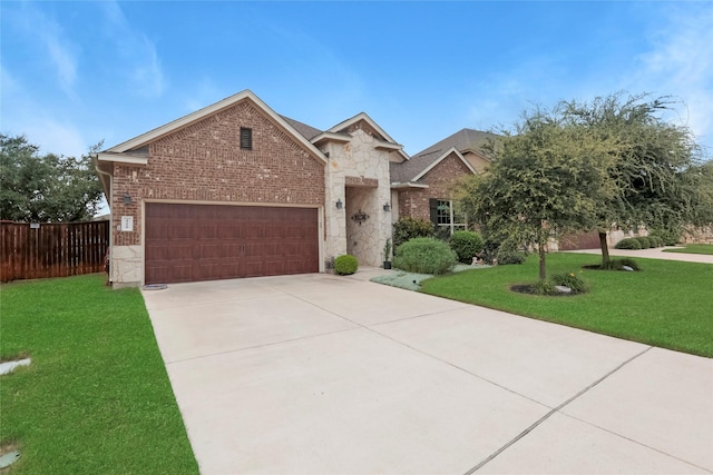 view of front of property with a garage and a front lawn