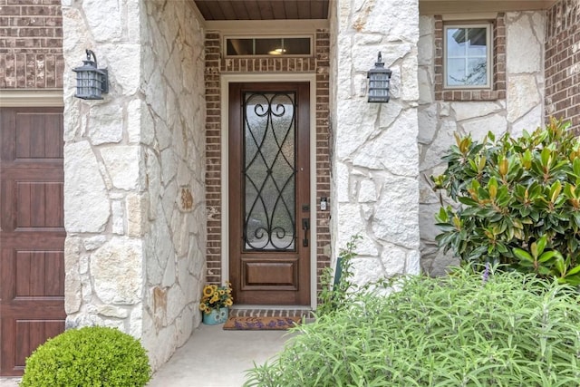 view of exterior entry with stone siding