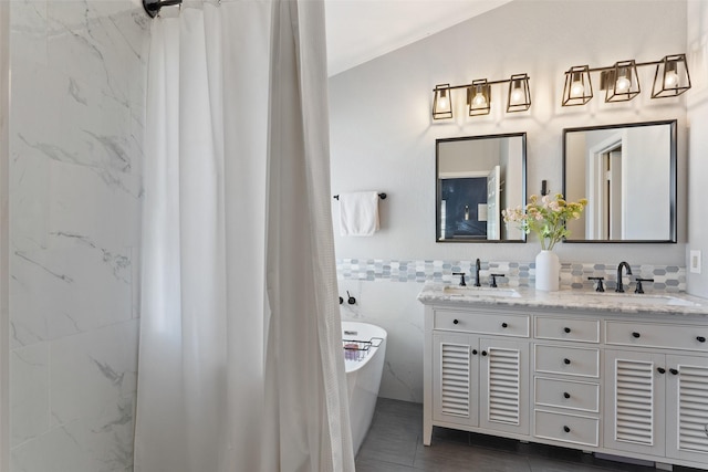 bathroom with shower with separate bathtub, vanity, tile patterned floors, and tile walls