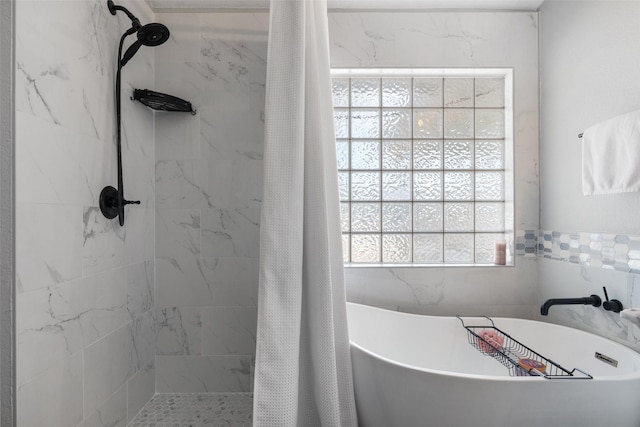 bathroom featuring tile walls and plus walk in shower