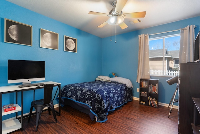 bedroom featuring ceiling fan and dark hardwood / wood-style floors