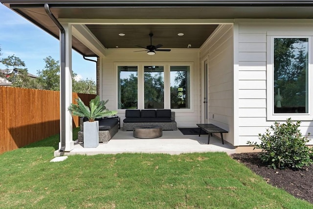 exterior space with ceiling fan and an outdoor living space