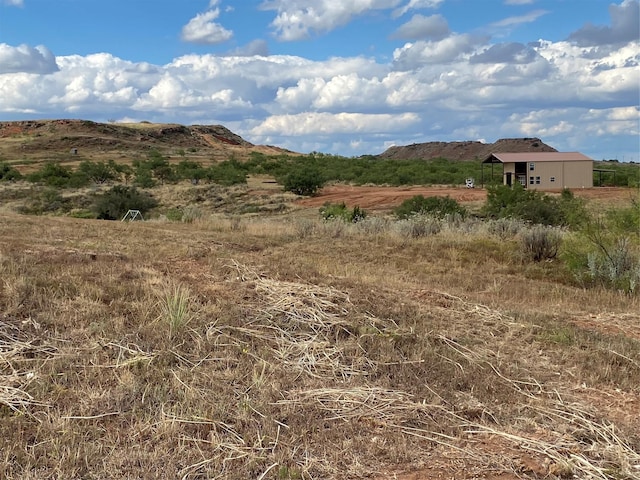 mountain view featuring a rural view