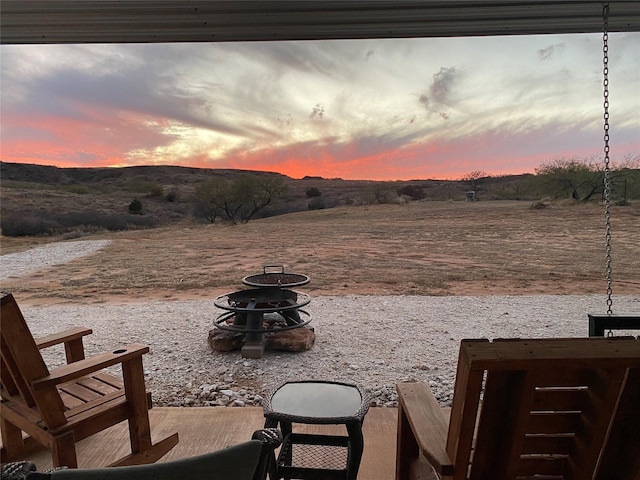 patio terrace at dusk with a fire pit