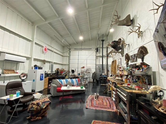 garage with a workshop area and an AC wall unit