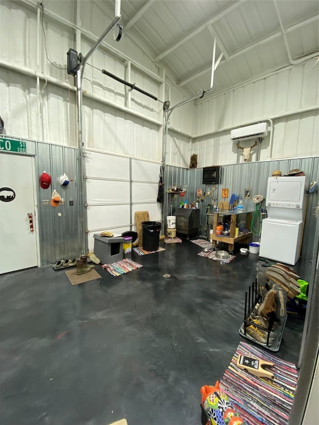 garage featuring stacked washer and dryer