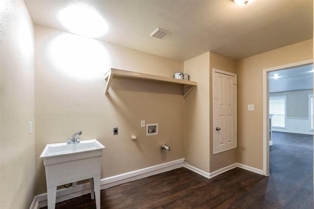 laundry room featuring dark hardwood / wood-style flooring, sink, hookup for a washing machine, hookup for an electric dryer, and gas dryer hookup