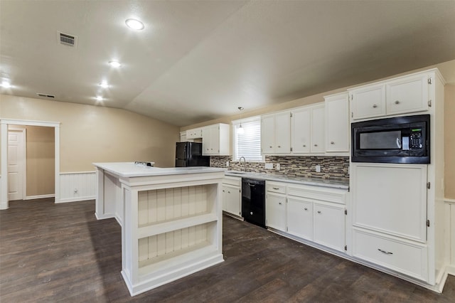 kitchen featuring black appliances, a kitchen island, white cabinets, and lofted ceiling