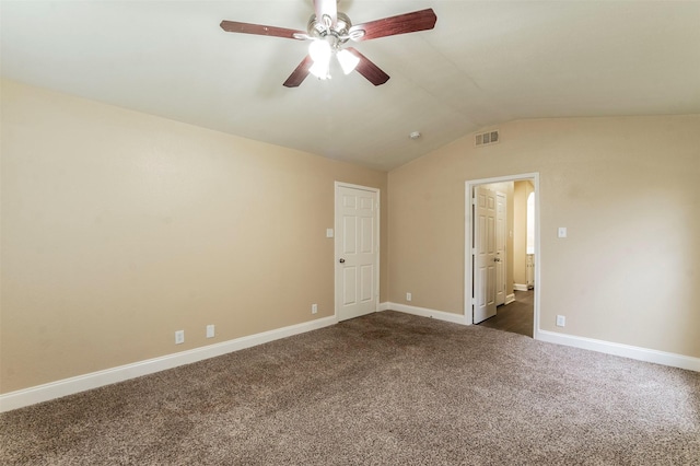 carpeted empty room with ceiling fan and lofted ceiling