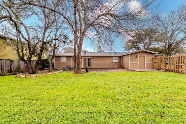 rear view of property with a patio area and a yard