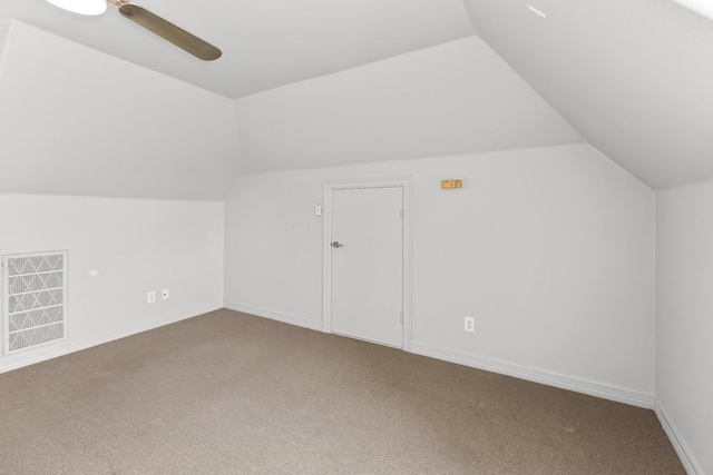 bonus room with ceiling fan, carpet flooring, and lofted ceiling