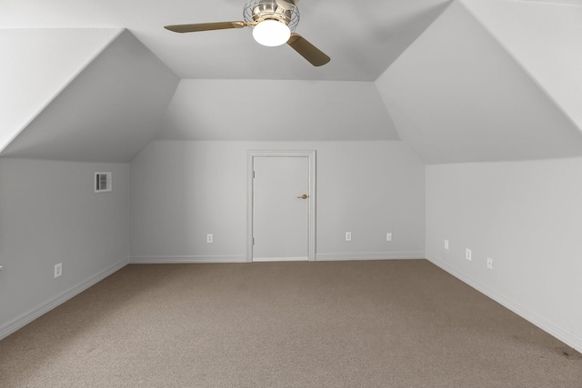 additional living space featuring ceiling fan, carpet flooring, and lofted ceiling