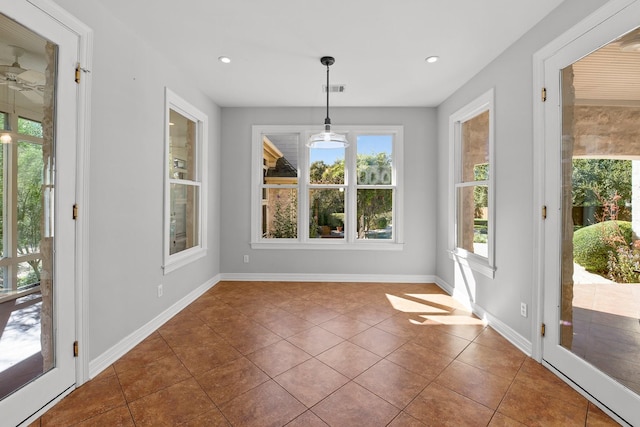 unfurnished dining area with tile patterned flooring