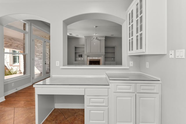 kitchen featuring white cabinetry and tile patterned flooring