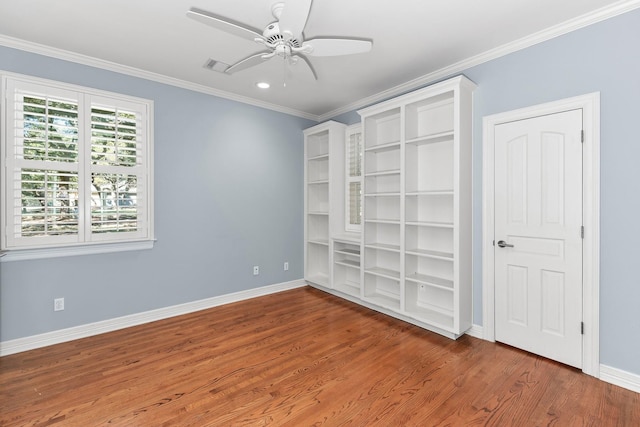 unfurnished bedroom with ornamental molding, ceiling fan, and hardwood / wood-style floors