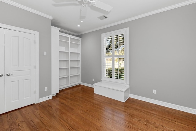 unfurnished bedroom with crown molding, wood-type flooring, and ceiling fan