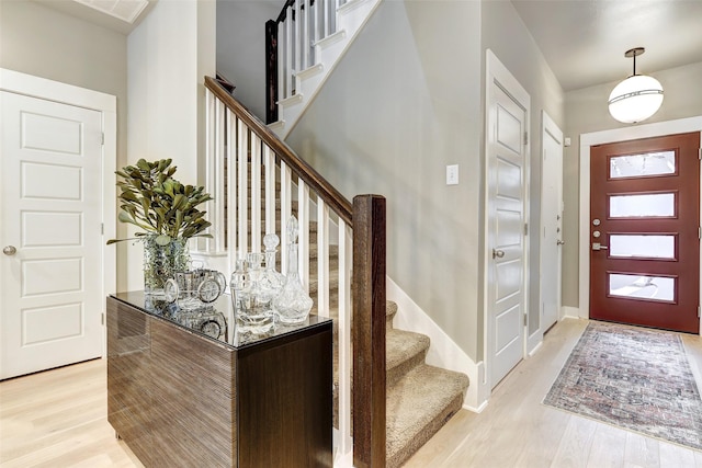 foyer with light hardwood / wood-style floors