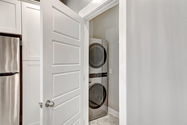 laundry room with stacked washer and clothes dryer